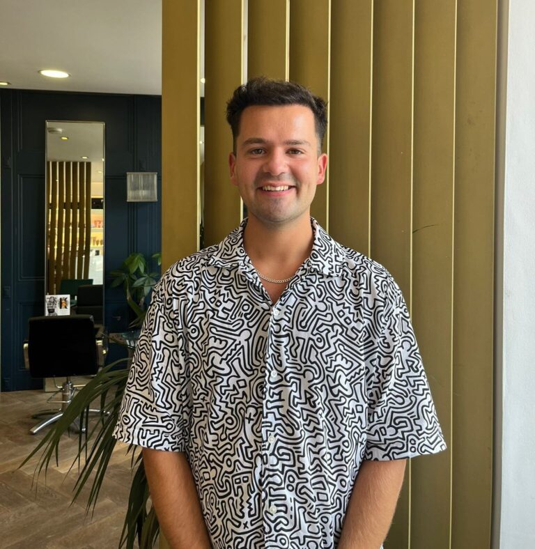 Sebastian, owner of Spoiled Hairdressing salon, smiling professional hairstylist in St Andrews